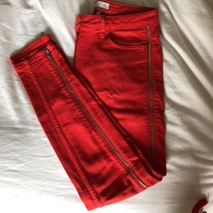 Red jeans with zipper down each side